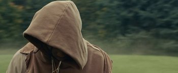 Movie still from “Travis Scott & Kanye West - Piss on your Grave” (2015), directed by Nabil Elderkin – Extreme Close Up shot, Low angle