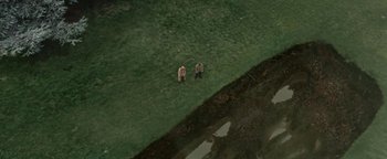 Movie still from “Travis Scott & Kanye West - Piss on your Grave” (2015), directed by Nabil Elderkin – Extreme Wide shot, Overhead angle