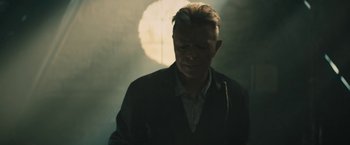 Movie still from “David Bowie - Blackstar” (2015), directed by Johan Renck – Medium shot, Low angle