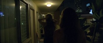 Movie still from “Florence & The Machine - Delilah” (2015), directed by Vincent Haycock – Medium shot, Over the shoulder angle