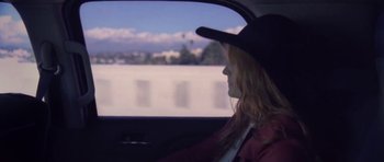 Movie still from “Florence & The Machine - Delilah” (2015), directed by Vincent Haycock – Medium shot, Low angle