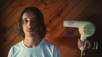 Movie still from “The Leers - I Can’t Cope” (2015), directed by Thunderlips – Close Up shot, Low angle