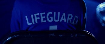 Movie still from “LarzRanda - Lifeguard” (2015), directed by Thunderlips – Medium shot, Overhead angle