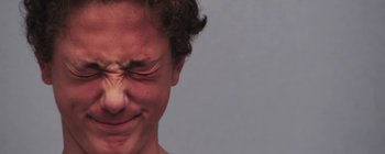 Movie still from “Gilligan Moss - Choreograph” (2015), directed by Oscar Hudson – Extreme Close Up shot, Low angle