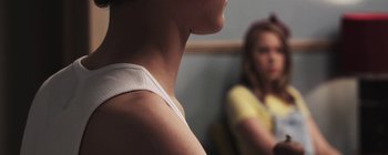 Movie still from “Gilligan Moss - Choreograph” (2015), directed by Oscar Hudson – Extreme Close Up shot, Over the shoulder angle