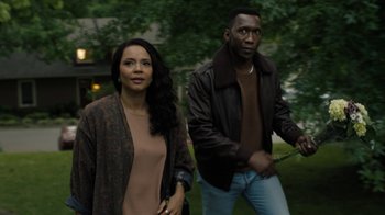 Movie still from “True Detective” (2014), created by Issa López – A man and a woman are walking in a park; Medium shot, Over the shoulder angle