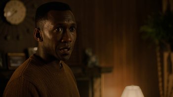 Movie still from “True Detective” (2014), created by Issa López – A person in a room near a lamp; Close Up shot, Over the shoulder angle