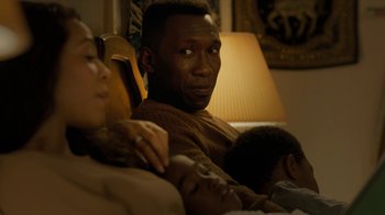 Movie still from “True Detective” (2014), created by Issa López – A man and a woman sitting next to each other on a bed; Close Up shot, Over the shoulder angle