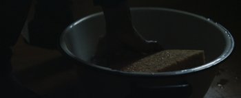 Movie still from “Flying Lotus - Coronus, The Terminator” (2015), directed by Young Replicant – Extreme Close Up shot, Overhead angle