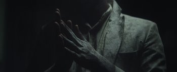 Movie still from “Flying Lotus - Coronus, The Terminator” (2015), directed by Young Replicant – Extreme Close Up shot, High angle