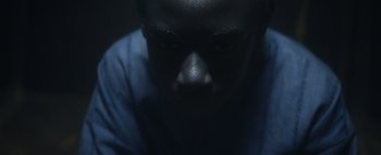 Movie still from “Flying Lotus - Coronus, The Terminator” (2015), directed by Young Replicant – Extreme Close Up shot, High angle