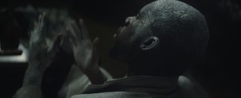 Movie still from “Flying Lotus - Coronus, The Terminator” (2015), directed by Young Replicant – Extreme Close Up shot, Overhead angle