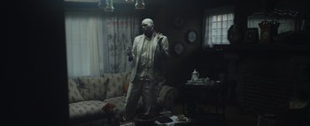 Movie still from “Flying Lotus - Coronus, The Terminator” (2015), directed by Young Replicant – Medium shot, Low angle