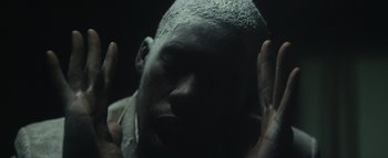 Movie still from “Flying Lotus - Coronus, The Terminator” (2015), directed by Young Replicant – Extreme Close Up shot, High angle