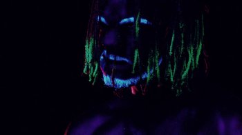 Movie still from “Major Lazer - Sweat” (2014), directed by Ryan Staake – Extreme Close Up shot, Low angle