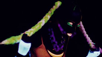 Movie still from “Major Lazer - Sweat” (2014), directed by Ryan Staake – Extreme Close Up shot, Low angle