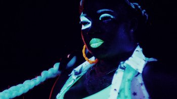 Movie still from “Major Lazer - Sweat” (2014), directed by Ryan Staake – Extreme Close Up shot, Overhead angle