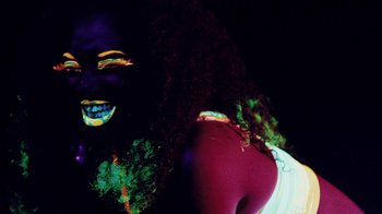 Movie still from “Major Lazer - Sweat” (2014), directed by Ryan Staake – Extreme Close Up shot, Low angle