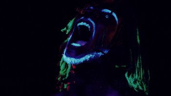 Movie still from “Major Lazer - Sweat” (2014), directed by Ryan Staake – Extreme Close Up shot, Low angle