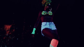 Movie still from “Major Lazer - Sweat” (2014), directed by Ryan Staake – Medium shot, Low angle