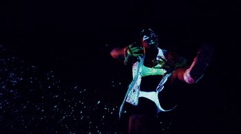 Movie still from “Major Lazer - Sweat” (2014), directed by Ryan Staake – Medium shot, Low angle