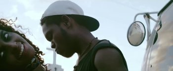 Movie still from “Little Dragon - Pretty Girls” (2014), directed by Nabil Elderkin – Close Up shot, Low angle