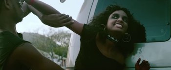 Movie still from “Little Dragon - Pretty Girls” (2014), directed by Nabil Elderkin – Close Up shot, Low angle