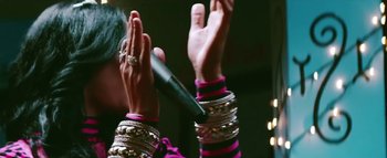 Movie still from “Little Dragon - Pretty Girls” (2014), directed by Nabil Elderkin – Close Up shot, Low angle