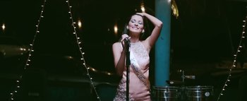 Movie still from “Little Dragon - Pretty Girls” (2014), directed by Nabil Elderkin – Medium shot, Low angle