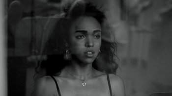 Movie still from “FKA Twigs - Video Girl” (2014), directed by Kahlil Joseph – Close Up shot, Low angle