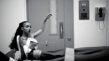 Movie still from “FKA Twigs - Video Girl” (2014), directed by Kahlil Joseph – Medium shot, Low angle