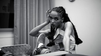 Movie still from “FKA Twigs - Video Girl” (2014), directed by Kahlil Joseph – Medium shot, High angle