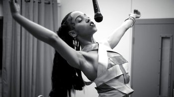 Movie still from “FKA Twigs - Video Girl” (2014), directed by Kahlil Joseph – Medium shot, Low angle