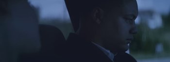 Movie still from “Dels - Burning Beaches” (2014), directed by Us – Close Up shot, Low angle