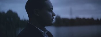 Movie still from “Dels - Burning Beaches” (2014), directed by Us – Close Up shot, Low angle