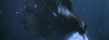 Movie still from “Dels - Burning Beaches” (2014), directed by Us – Extreme Close Up shot, Low angle