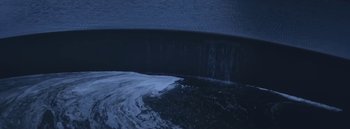 Movie still from “Dels - Burning Beaches” (2014), directed by Us – Medium shot, Overhead angle