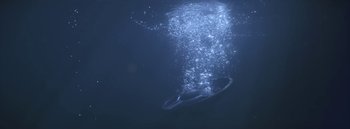 Movie still from “Dels - Burning Beaches” (2014), directed by Us – Extreme Wide shot, Overhead angle