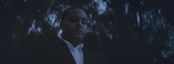 Movie still from “Dels - Burning Beaches” (2014), directed by Us – Close Up shot, Low angle