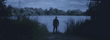 Movie still from “Dels - Burning Beaches” (2014), directed by Us – Wide shot, Over the shoulder angle