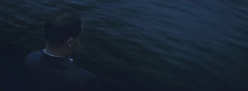 Movie still from “Dels - Burning Beaches” (2014), directed by Us – Medium shot, High angle