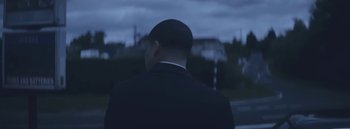 Movie still from “Dels - Burning Beaches” (2014), directed by Us – Medium shot, Low angle