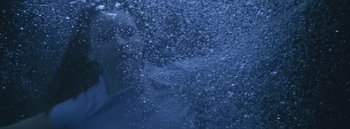 Movie still from “Dels - Burning Beaches” (2014), directed by Us – Medium shot, High angle