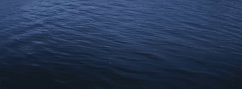 Movie still from “Dels - Burning Beaches” (2014), directed by Us – Extreme Wide shot, High angle