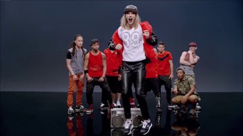 Movie still from “Taylor Swift - Shake It Off” (2014), directed by Mark Romanek – Wide shot, Low angle