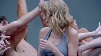 Movie still from “Taylor Swift - Shake It Off” (2014), directed by Mark Romanek – Medium shot, Over the shoulder angle