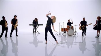 Movie still from “Taylor Swift - Shake It Off” (2014), directed by Mark Romanek – Wide shot, Low angle