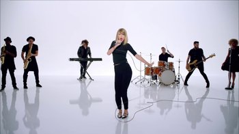 Movie still from “Taylor Swift - Shake It Off” (2014), directed by Mark Romanek – Wide shot, Low angle
