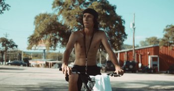 Movie still from “Alt-J - Left Hand Free” (2014), directed by Ryan Staake – Medium shot, Low angle