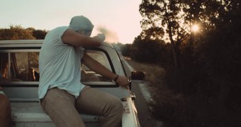 Movie still from “Alt-J - Left Hand Free” (2014), directed by Ryan Staake – Medium shot, Low angle